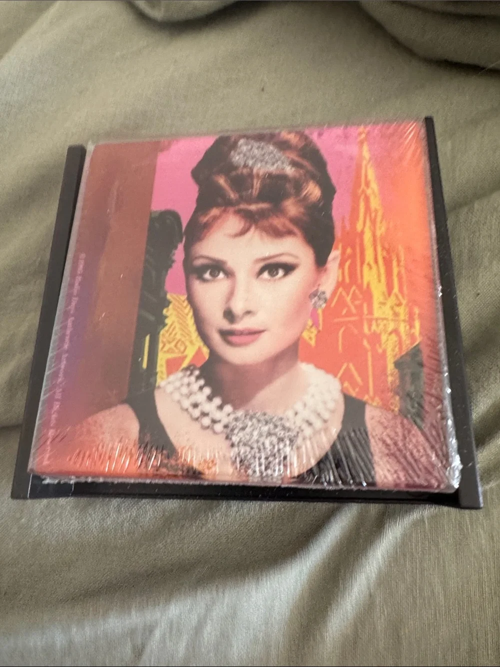 Audrey Hepburn Breakfast at Tiffanys glass coaster set of 4 different images.